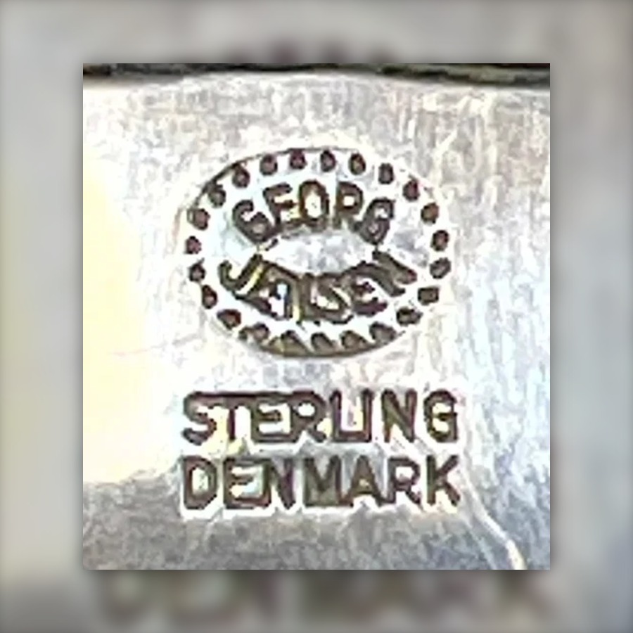 Georg Jensen Incuse Dotted Oval Mark with Sterling Denmark hallmark, GEORG over JENSEN inside an oval of dots, letters struck incuse, with STERLING DENMARK or 925 S and often a design number