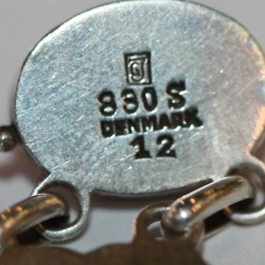 Georg Jensen Square GJ Mark, 1933 to 1944 hallmark, Stylized GJ monogram set inside a square, with 925S or STERLING and DENMARK