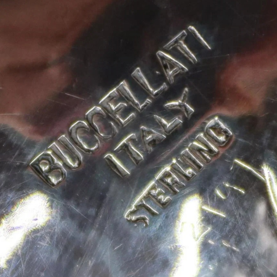 Buccellati Italy Sterling Flatware Mark hallmark, BUCCELLATI ITALY STERLING (or BUCCELLATI STERLING ITALY), sometimes with the Italian star lozenge, a registration number and MI, and 925